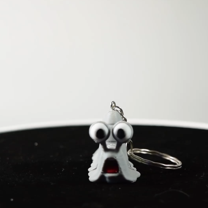 Grey Snail Keychain – Flexible Toy  Bag Charm with Big Eyes